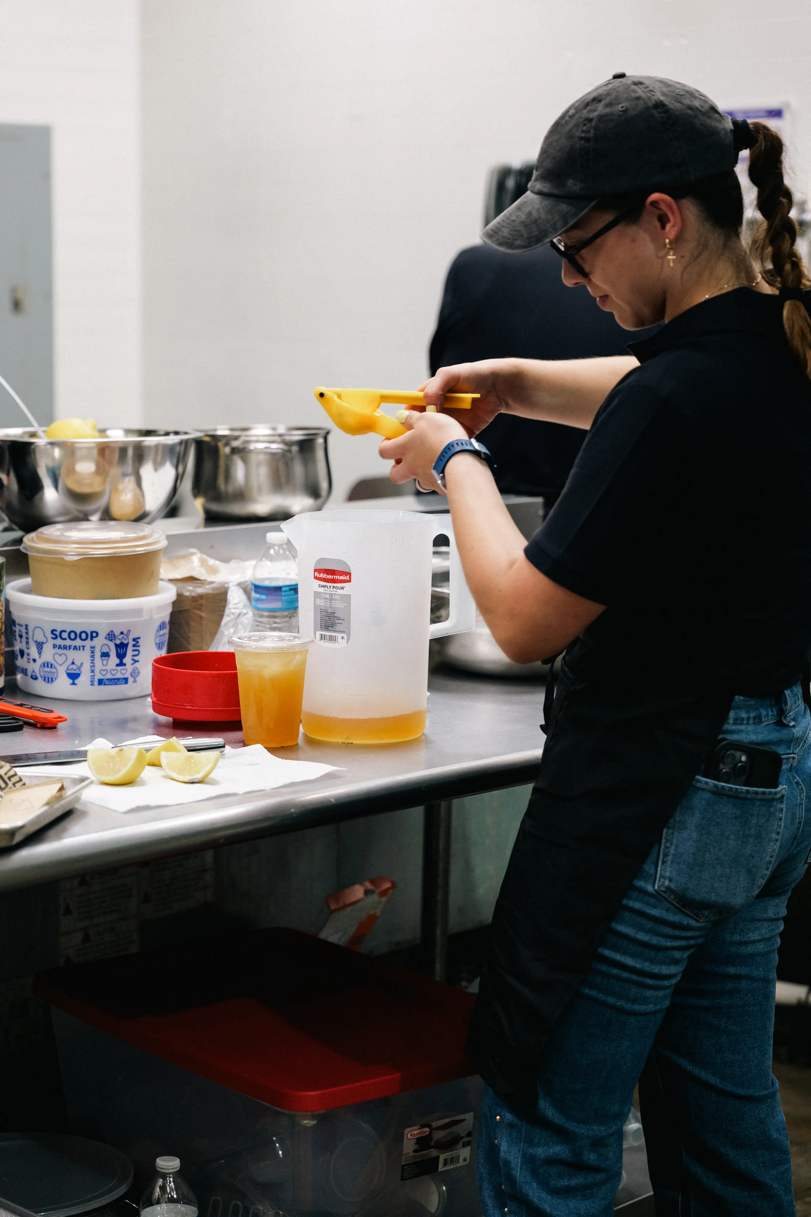 A Pardito's cook prepping ingredients at the stainless steel kitchen bench